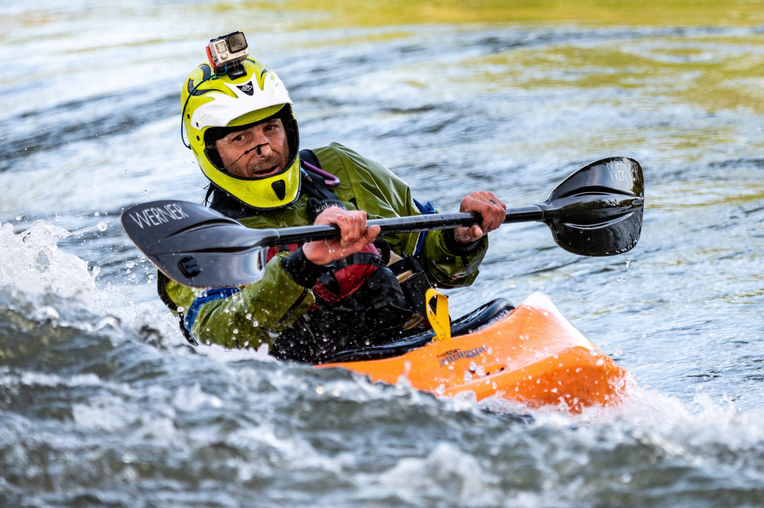 a man vlogging while kayaking